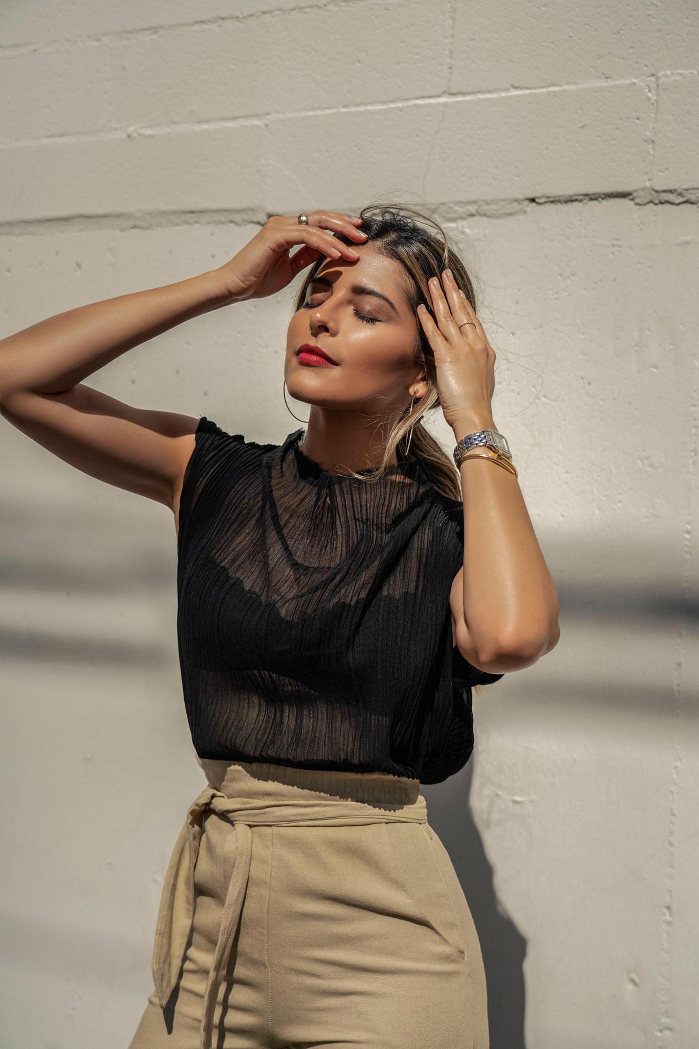 Chic Outfits That Never Go Out of Style by Pam Hetlinger | TheGirlFromPanama.com | Black Sheer Top, Sheer top outfit, tie waist trousers, chic weekend style, classy style