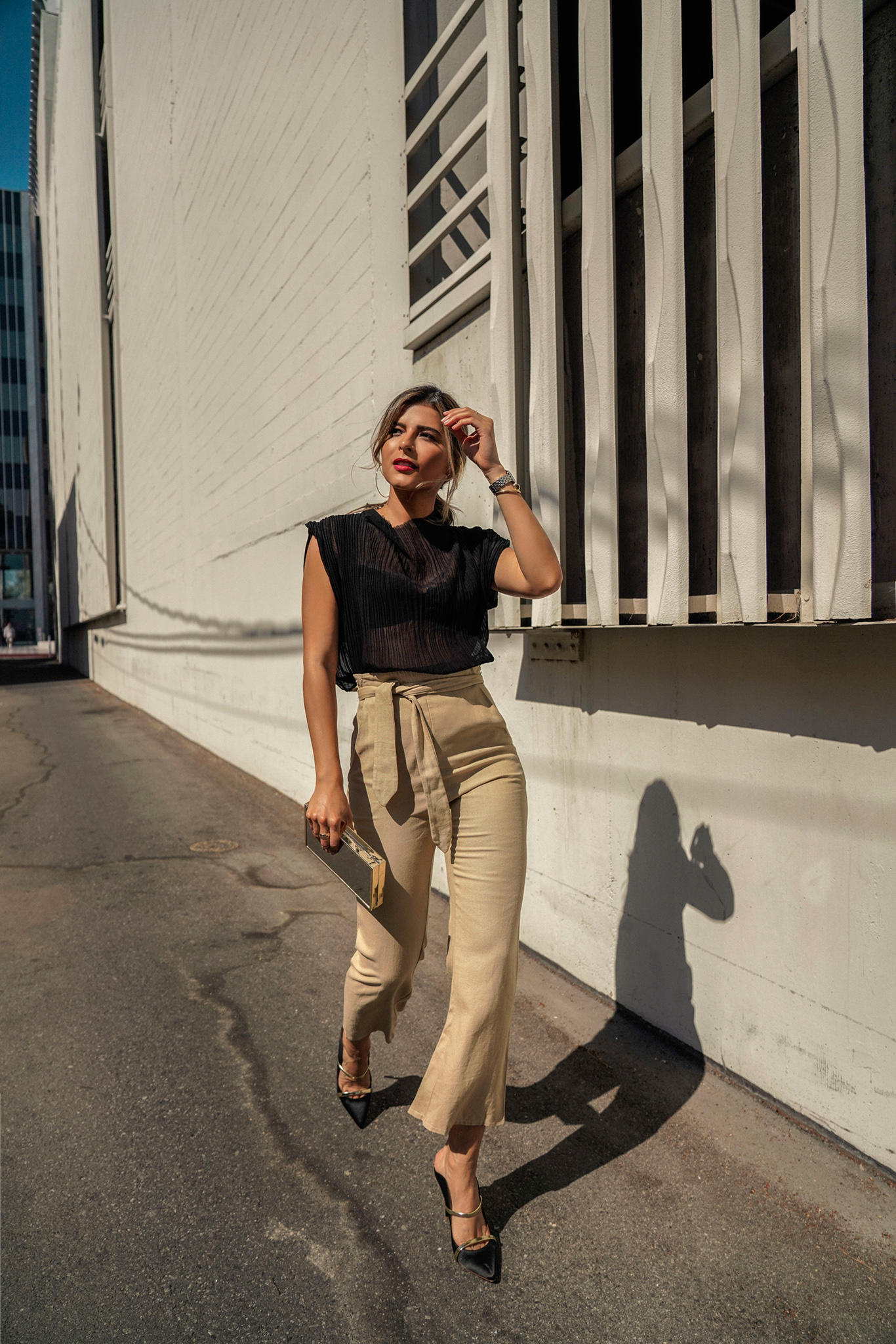 Chic Outfits That Never Go Out of Style by Pam Hetlinger | TheGirlFromPanama.com | Black Sheer Top, Sheer top outfit, tie waist trousers, chic weekend style, classy style