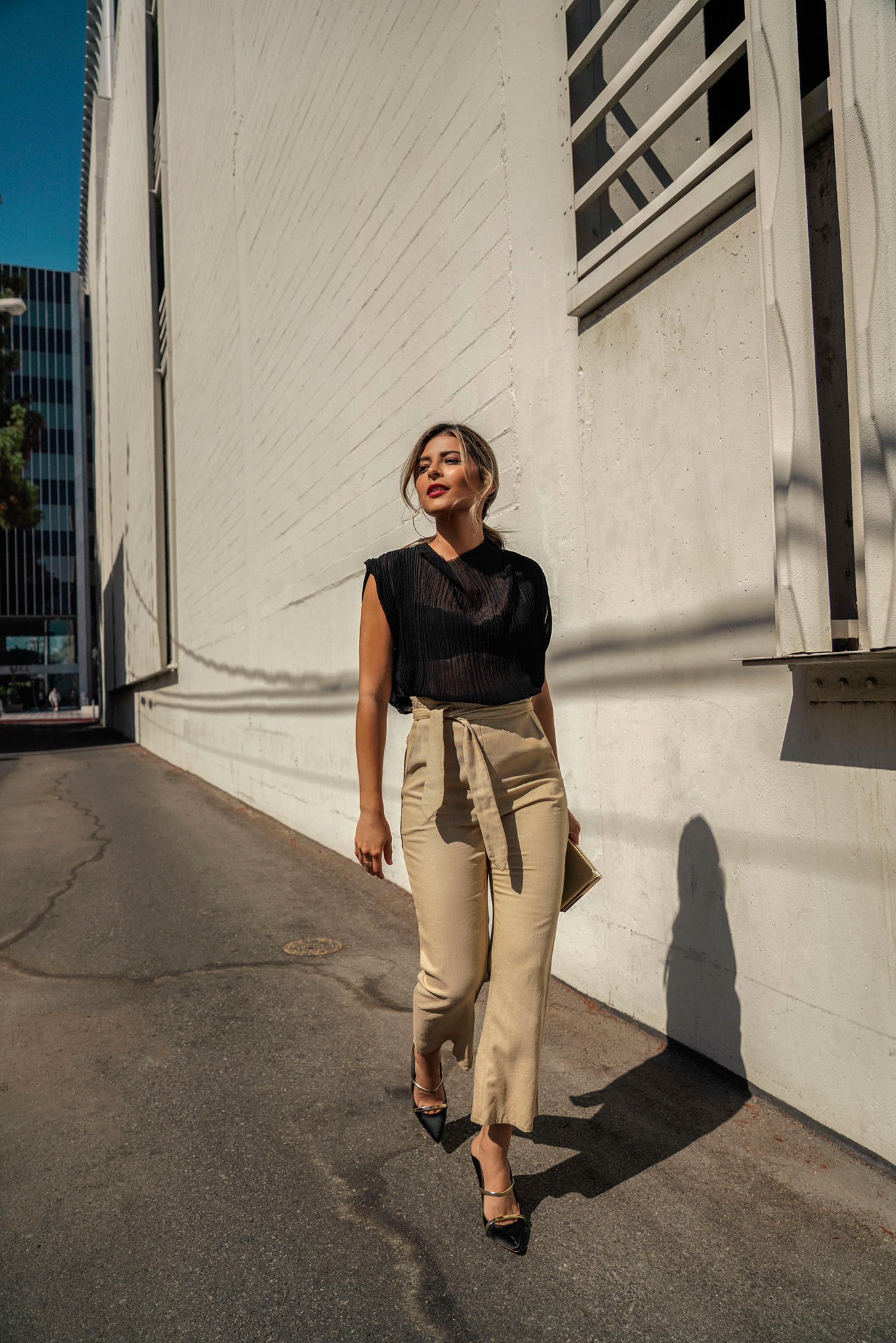 Chic Outfits That Never Go Out of Style by Pam Hetlinger | TheGirlFromPanama.com | Black Sheer Top, Sheer top outfit, tie waist trousers, chic weekend style, classy style