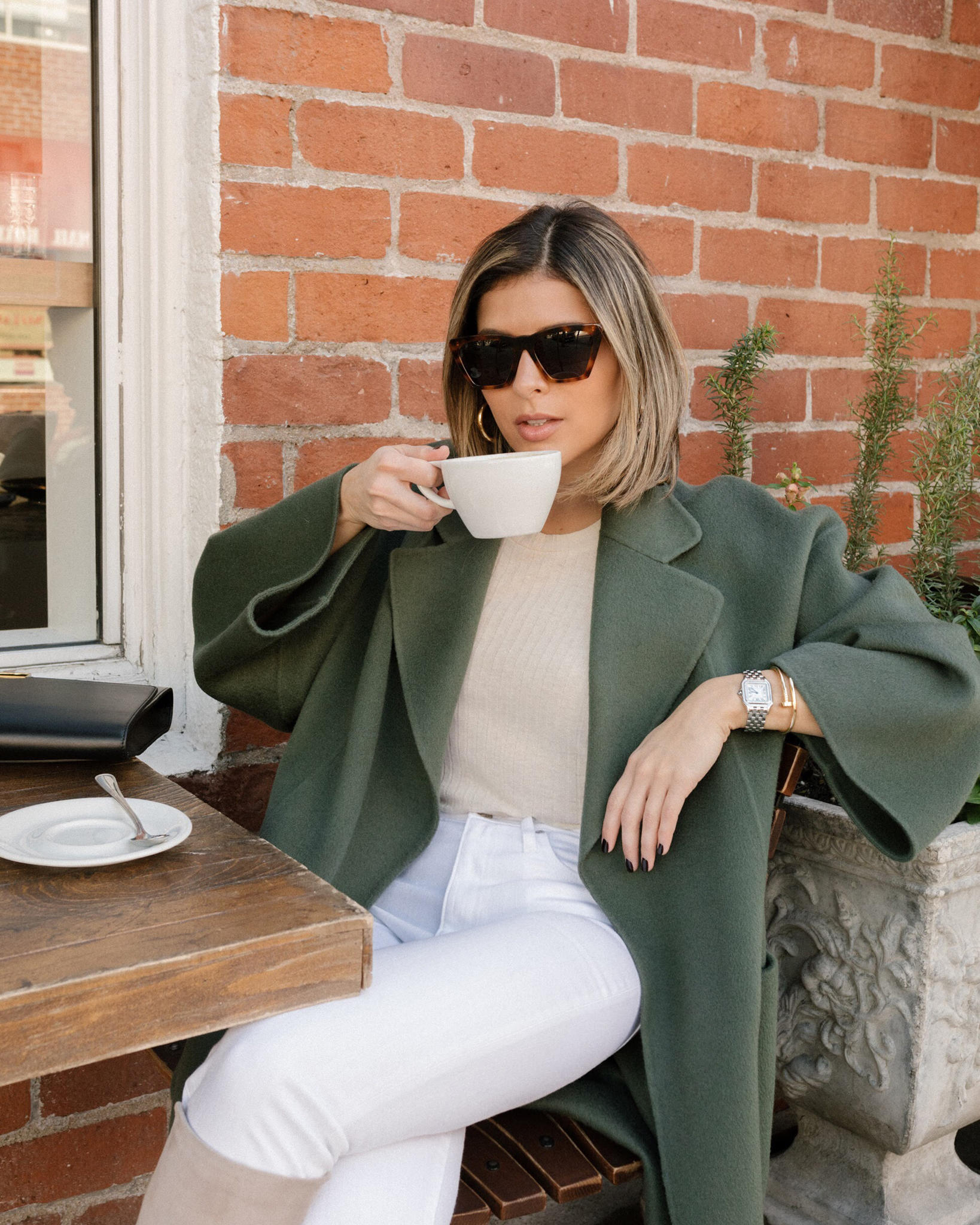 How to Wear White Jeans in the Winter by Pam Hetlinger | TheGirlFromPanama.com | Green Coat, Knee High Boots, Tan Boots, White Skinny Jeans, winter white