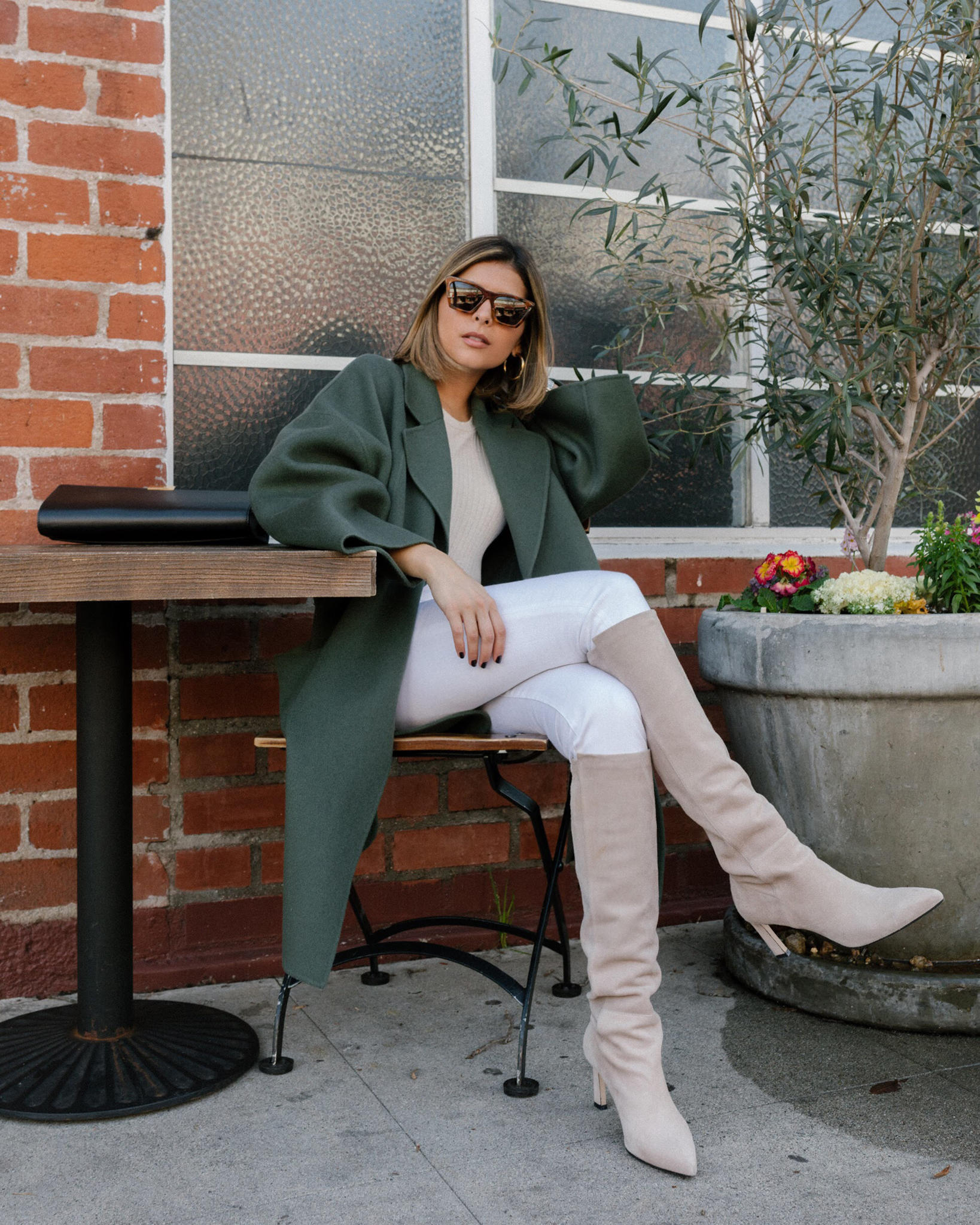 How to Wear White Jeans in the Winter by Pam Hetlinger | TheGirlFromPanama.com | Green Coat, Knee High Boots, Tan Boots, White Skinny Jeans, winter white