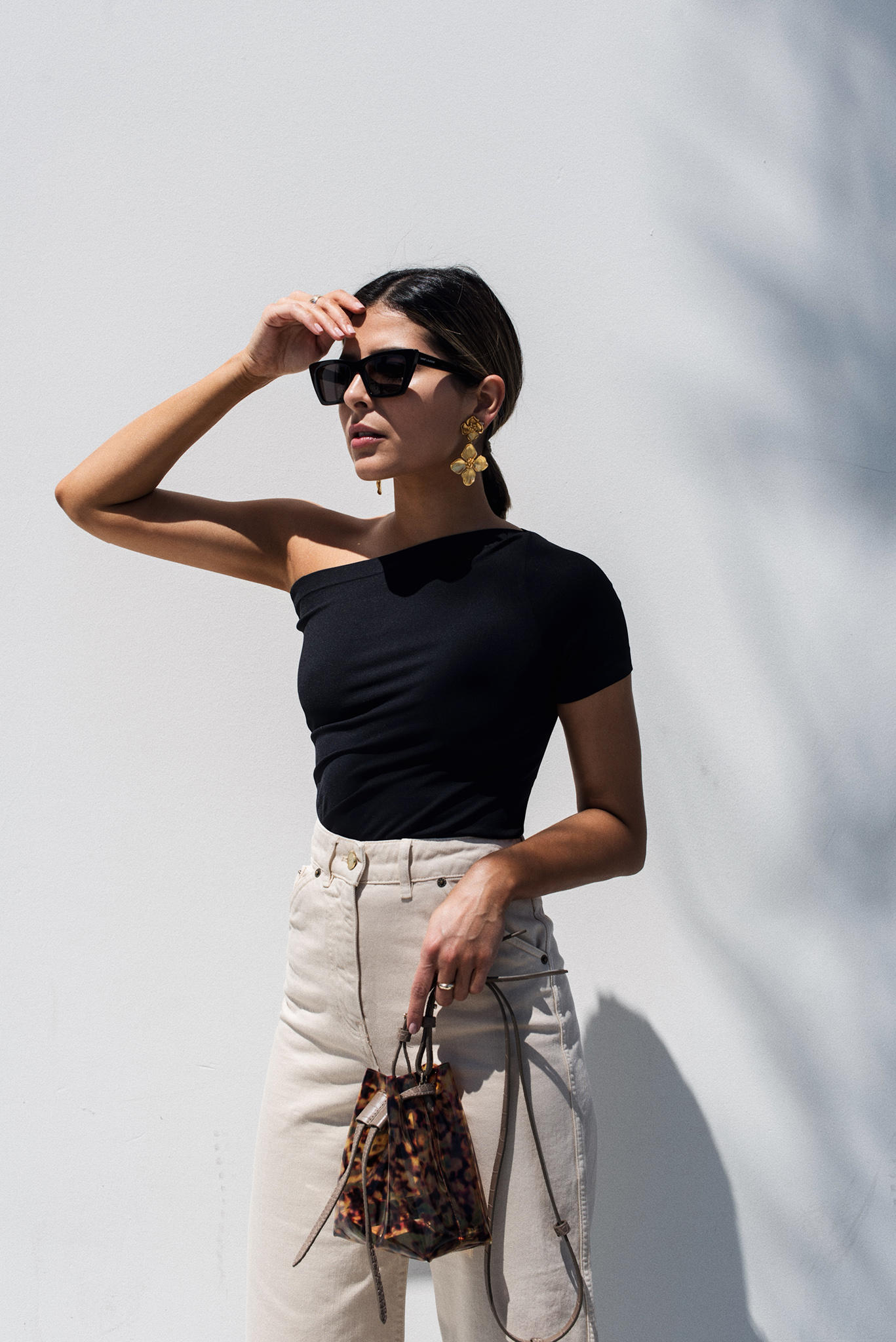 Pieces to bring on your next vacation, trendy vacation outfits, cropped pants trend, saint laurent sunglasses, nanushka bag | TheGirlFromPanama.com