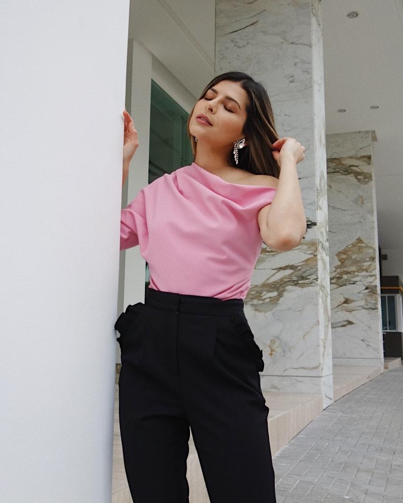 how to wear pink the right way, pam hetlinger wearing pink zara asymmetric neckline top, black rebecca taylor spring ruffle pants, saint laurent strappy sandals, and diamond drop earrings | the girl from panama